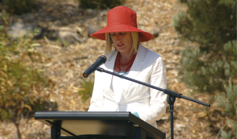 Katy Gallagher speaking from a lectern in an outdoor setting.