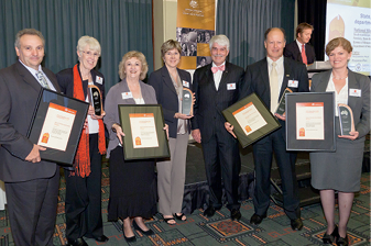 Roger Wilkins AO with Vernon Carr, Pauline Cole, John Nairn, Graeme Wynwood, Val Smyth, Christine Andrews and Tracey Siebert.
