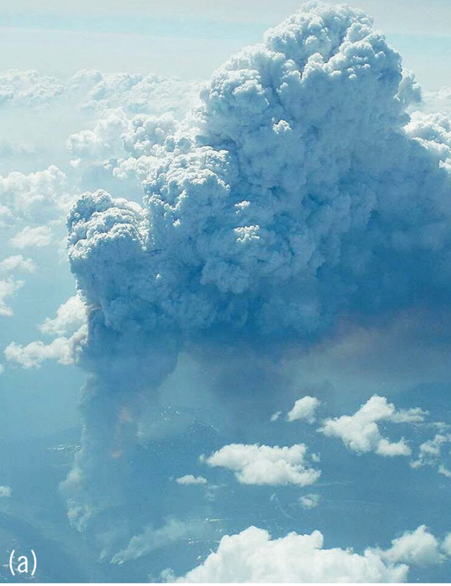 An aerial view of a large smoke cloud.