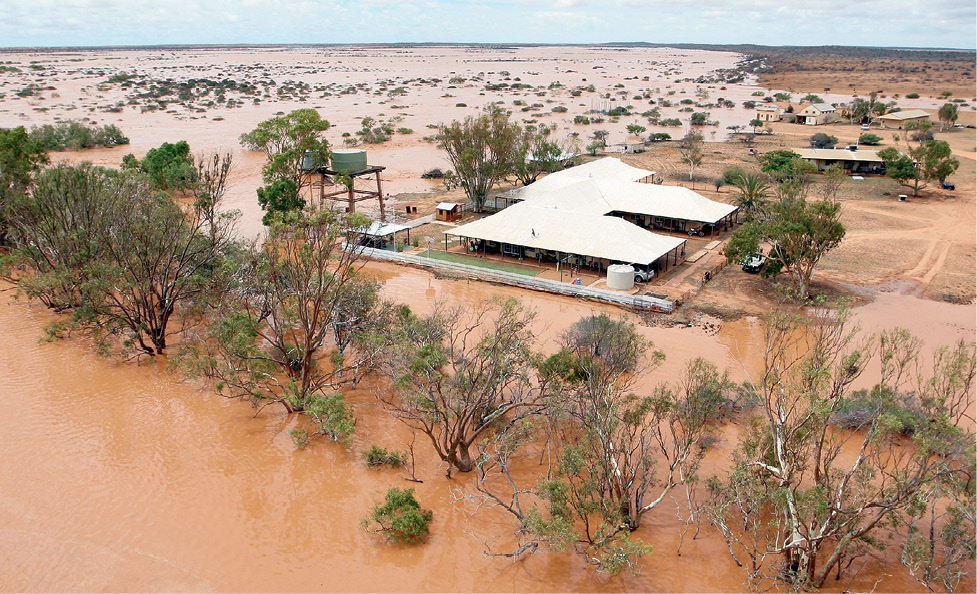 Aerial Photograph of the station showing massive flooding over the land and up to the station