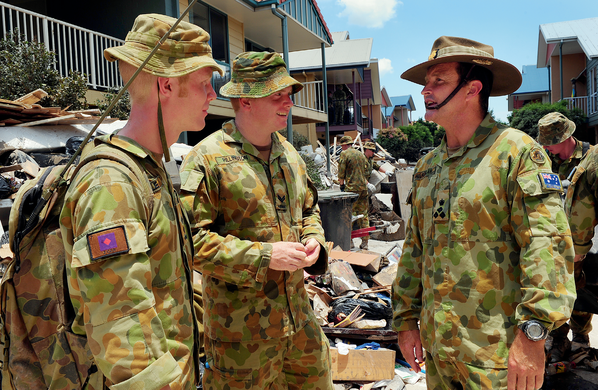 Photograph of army personnel helping during the Queensland floods.