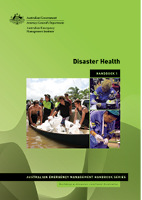 A photograph of a disaster health handbook. The cover is green and shows emergency workers during disaster relief operations.