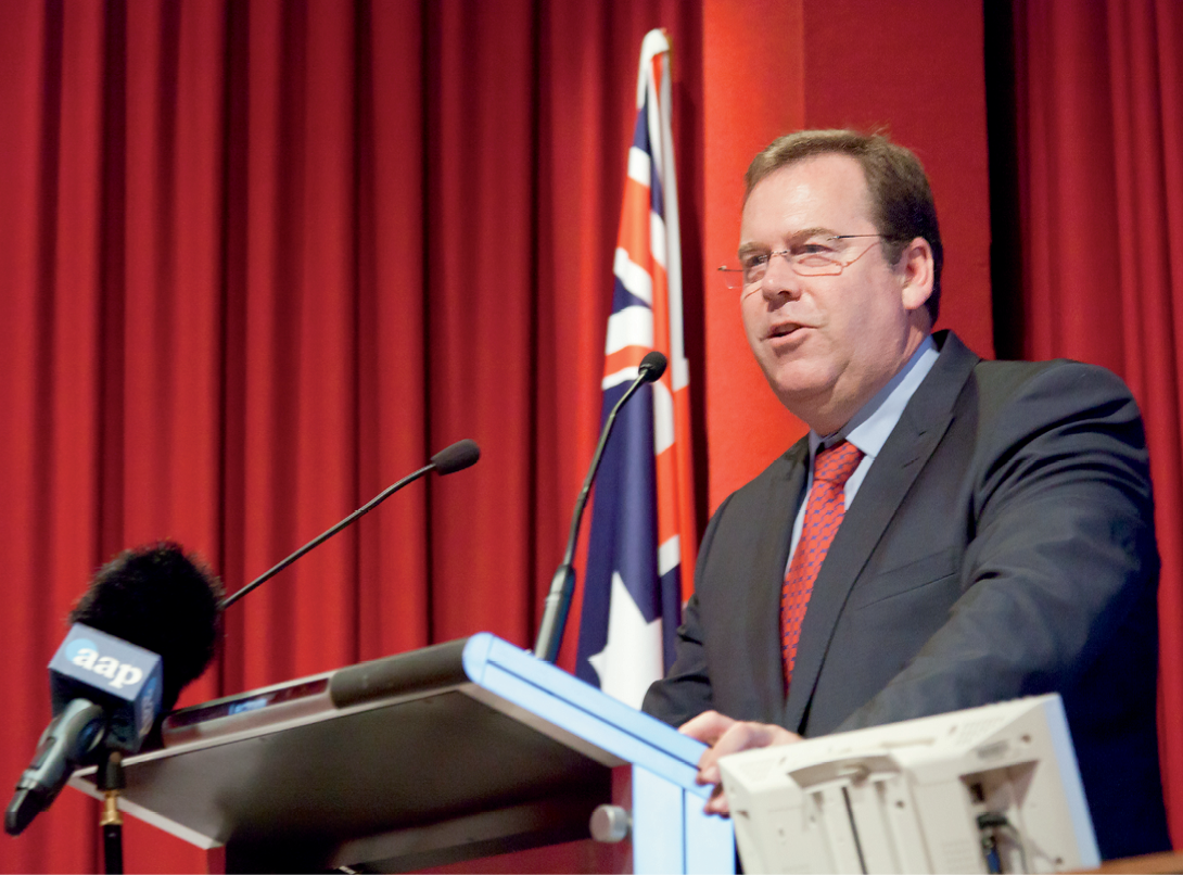 Photograph of the Hon Robert McClelland speaking from behind a podium