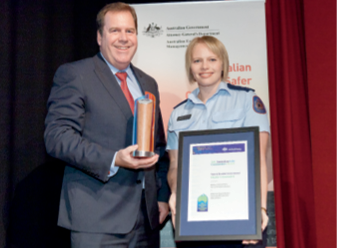 Photograph of the Hon Robert McClelland with award winner from Northern Territory Police, Fire and Emergency Services