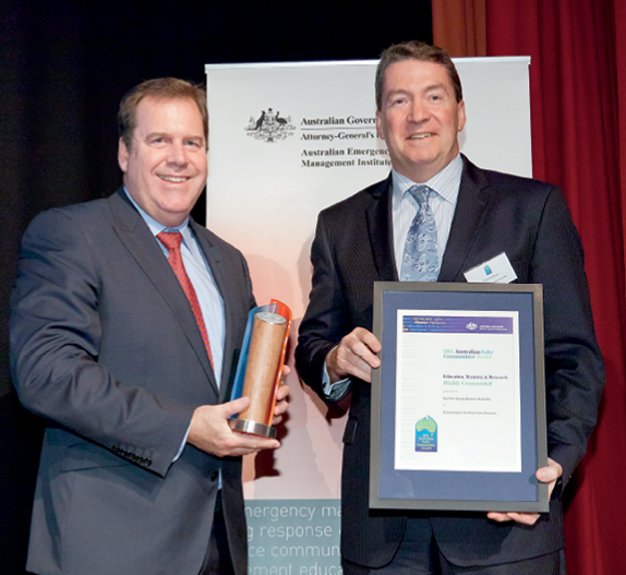 Photograph of the Hon Robert McClelland with award winner from Surf Life Saving Western Australia