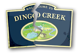 A sign reading ‘Welcome to Dingo Creek’, broken in half