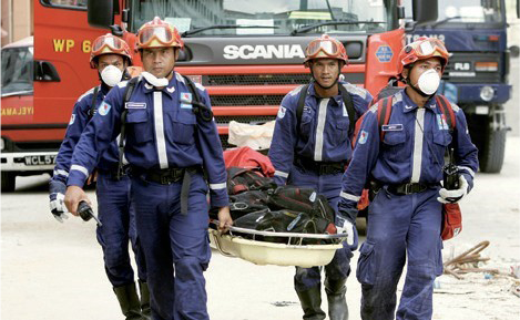 Photograph of four members of a special response team in uniform participating in a drill