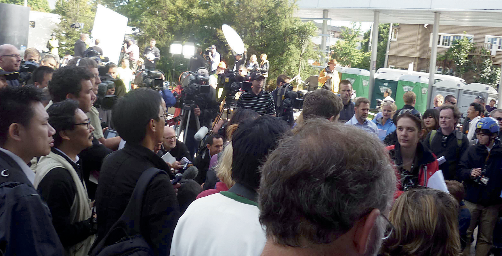 Photograph of a crowd of media personnel