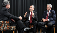 Dr John Harrison at the University of Queensland public meeting, with EMPA CEO Peter Rekers, interview Bob Jensen, seated on an open stage.