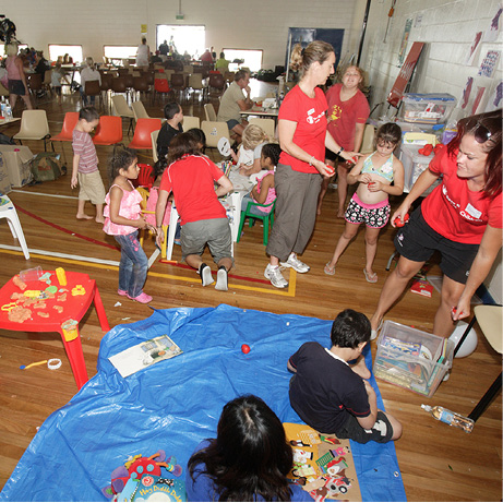 A photo of several children playing together indoors.