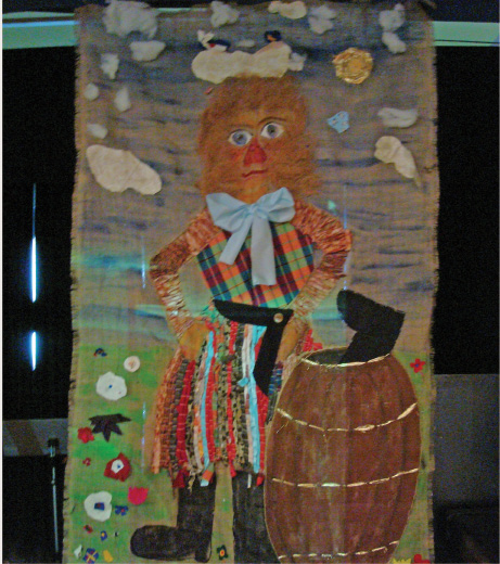 An artistic representation of a woman, who is ‘Katla’. She is standing beside a barrel of whey, and boots can be seen poking out of the barrel.