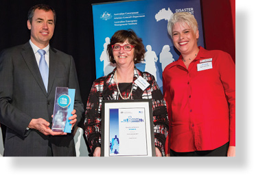 A photo of Hon. Michael Keenan MP with award winners Keturah Whitford and Kym Schmid.