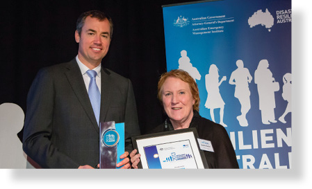 A photo of Hon. Michael Keenan MP with award winner Sandra Slatter.