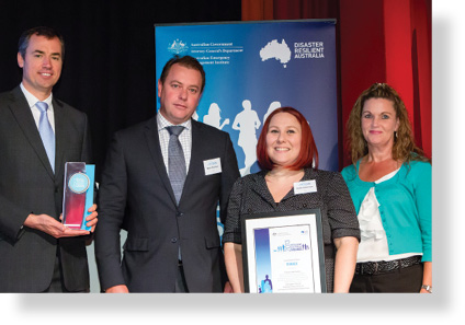 A photo of Hon. Michael Keenan MP with award winners Brett Reeman, Katie Edmiston and Tanya Milligan.