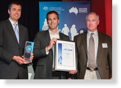 A photo of Hon. Michael Keenan MP with award winners Chris Collins and Damien Killalea.