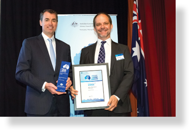 A photo of Hon. Michael Keenan MP with award winner Norman Mueller 
