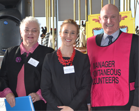 Kathy Ryan, Gabrielle Williams and Craig Lapsley. Craig is wearing a bright pink vest labelled ‘Manager Spontaneous Volunteers’.