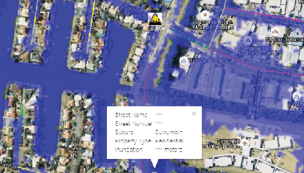 An aerial view of a harbour landscape with simulated water inundation. An overlay displays street names and names of some buildings. A pop-up text frame displays specific information for an individual address including height of inundation.